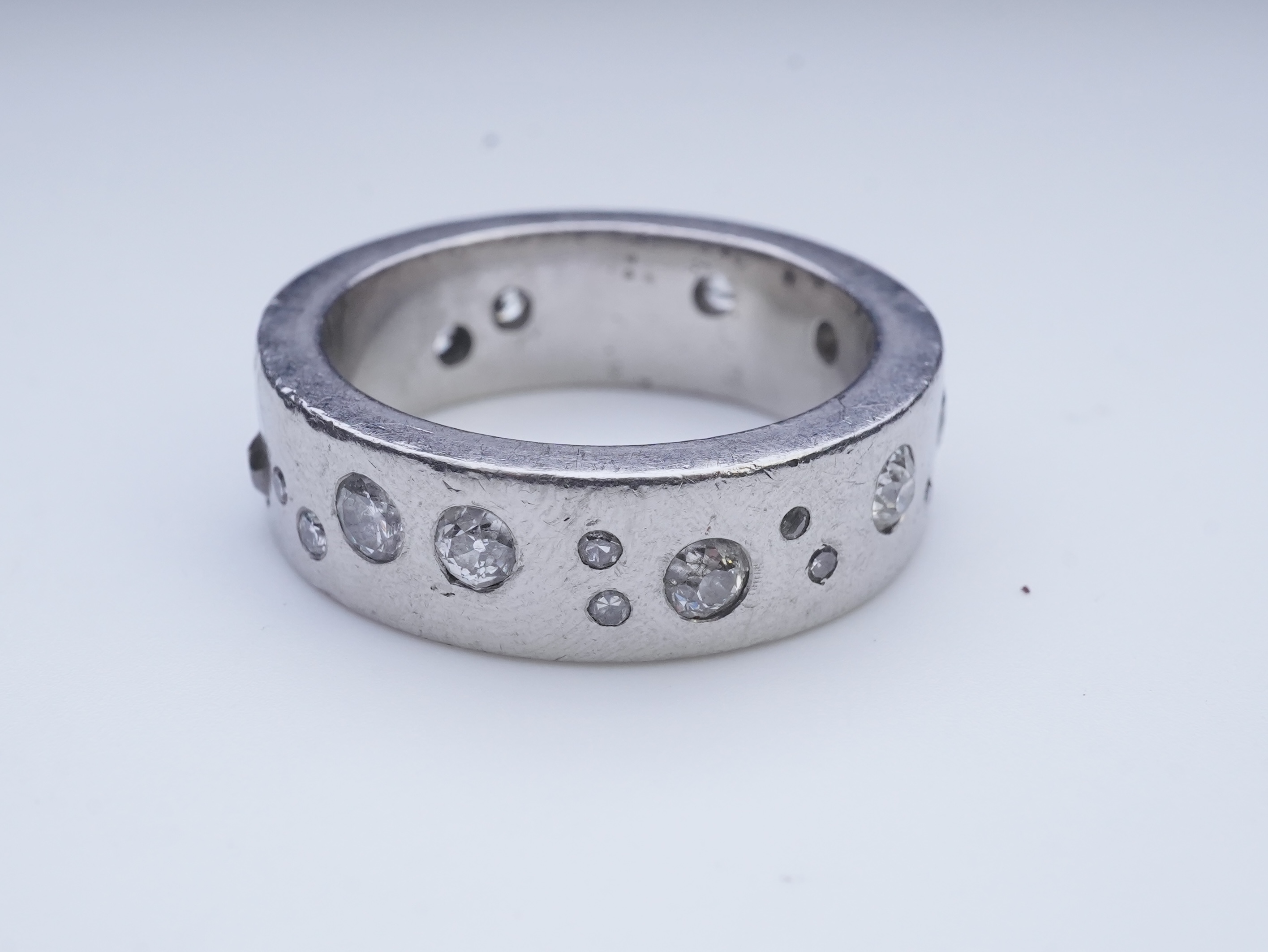 A platinum and diamond eternity ring